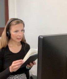 image of a woman looking at computer 
