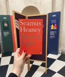 a copy of seamus heaney's poetry collection 'electric light' in the exhibition entrance 