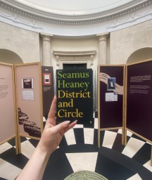 a copy of seamus heaney's poetry collection 'district and circle' in the exhibition entrance 