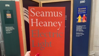 a copy of seamus heaney's poetry collection 'electric light' in the exhibition entrance 