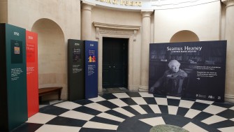 image of large space with black and white floor tiles and heaney signage 