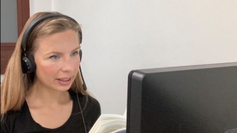 image of woman looking at computer 