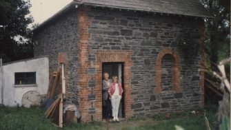 seamus and marie heaney stand in the doorway of glanmore cottage