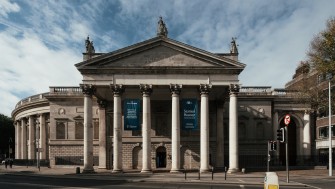 A photograph of the front of the building from Westmoreland Street showing the front columns and the entrance door.