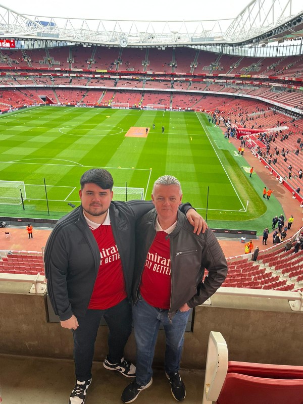 James Harte with his son standing in a stadium