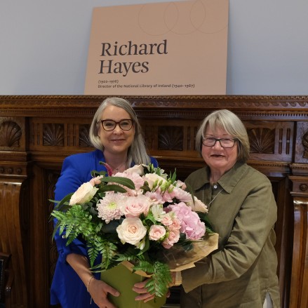 Dr Audrey Whitty and Faery Hayes holding flowers