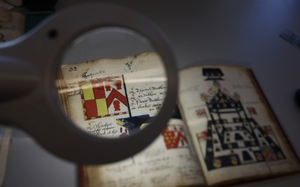 Image of old manuscript book open under microscope