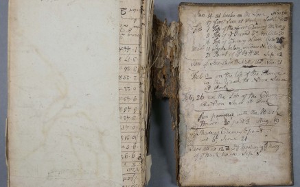 Old book on table with handwriting - MS 2104 is a volume of manuscript maps, dated c. 1750