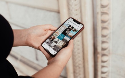 Woman using mobile to view Instagram