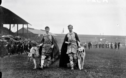 Two men with wolfhounds at Tailteann Opening Parade. 