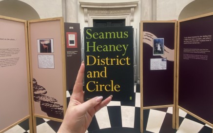 a copy of seamus heaney's poetry collection 'district and circle' in the exhibition entrance 